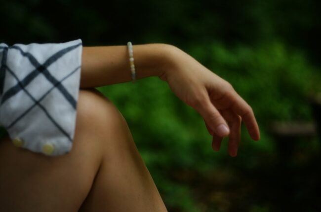 Arm resting with a bracelet.