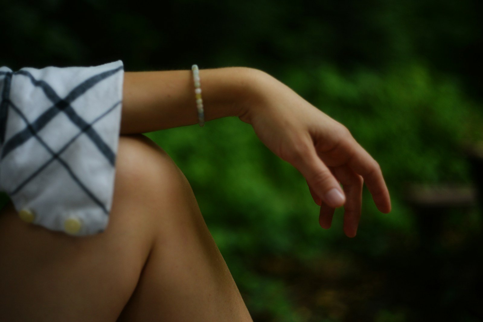 Arm resting with a bracelet.
