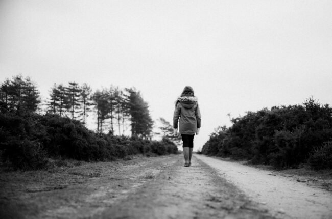 woman walking on road